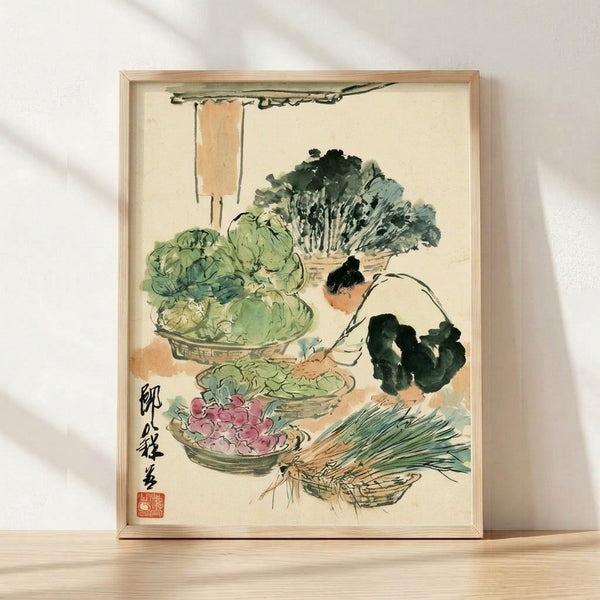 Framed Japanese watercolor art print depicting a woman in traditional dress sorting fresh vegetables and leafy greens among woven baskets, rendered in soft sage green, pink, and terracotta tones with black ink details in a folk art style.