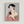 Framed Japanese woodblock portrait of a woman in ornate green and red kimono gazing into a hand mirror, featuring gold details and a contemplative mood against a cream background.