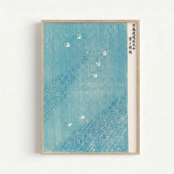 Minimalist woodblock art depicting peaceful water scene with birds and teal waves in traditional Japanese aesthetic; framed wall art with cream-colored background.