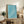 Peaceful Japanese woodblock design featuring birds and undulating waves in serene turquoise tones; minimalist framed print displayed on wall.