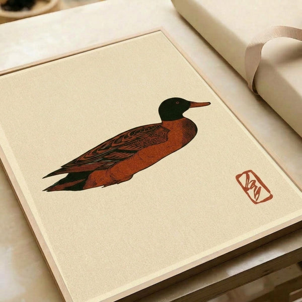 Minimalist duck woodblock print in cream and rust hues with refined brushwork, presented as a framed poster reflecting serene Japanese artistic tradition and contemporary japandi design.