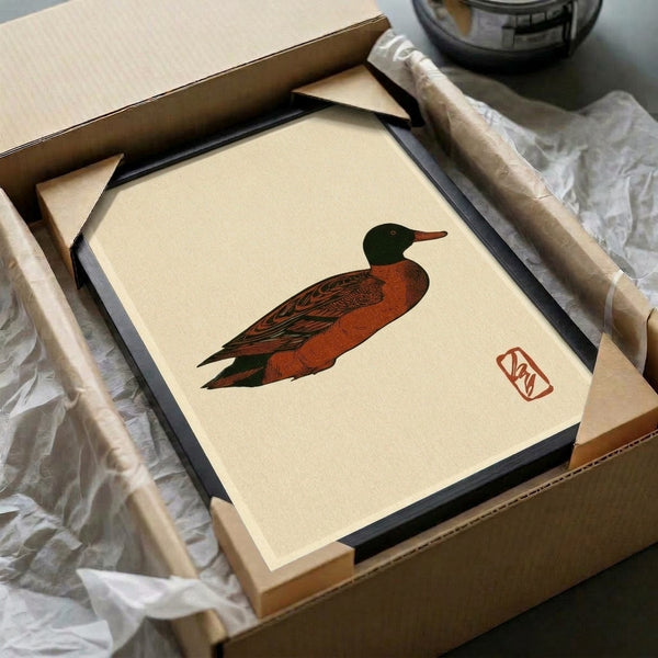 Delicate waterfowl rendered in Japanese woodblock style using cream, terracotta, and black, displayed as a framed wall art capturing naturalistic beauty and meditative wabi-sabi sensibility.