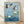 Serene Japanese woodblock-style framed poster featuring mallard ducks and koi swimming among lotus flowers and lily pads in soft blues, teals, and cream tones.