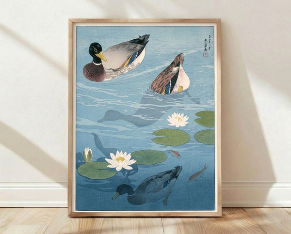 Serene Japanese woodblock-style framed poster featuring mallard ducks and koi swimming among lotus flowers and lily pads in soft blues, teals, and cream tones.