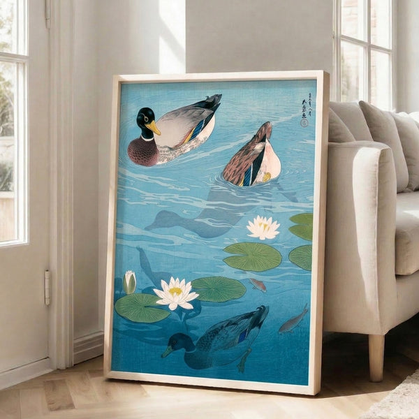 Japanese-influenced wall print capturing a peaceful water garden with swimming ducks, koi fish, and lotus flowers against a subtle cream and teal background.