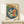 Art Nouveau food print showing elegant dumplings on a decorative blue plate with chopsticks, painted in warm cream and cool navy hues with touches of orange and green.