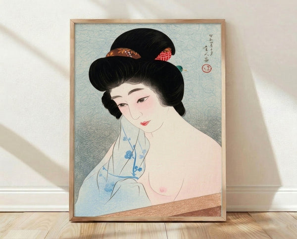 Serene Japanese geisha portrait in woodblock print style, featuring a woman in an elegant kimono with pale blue and cream tones, adorned with gold hair ornaments, framed on a wall.