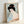 Showa era Japanese geisha portrait rendered in classic woodblock style, depicting a poised woman in decorative kimono with refined gold and coral red detailing.