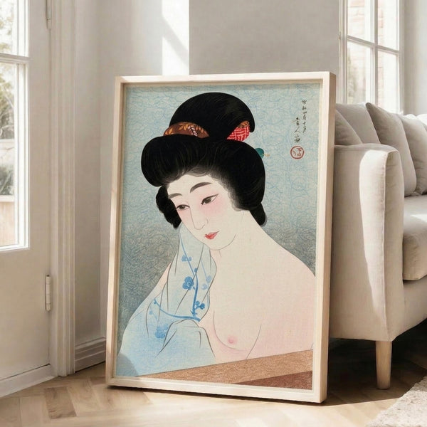 Elegant framed geisha print featuring intricate woodblock art with serene expression, cream and pale blue palette accented by black strokes and gold ornamental details.