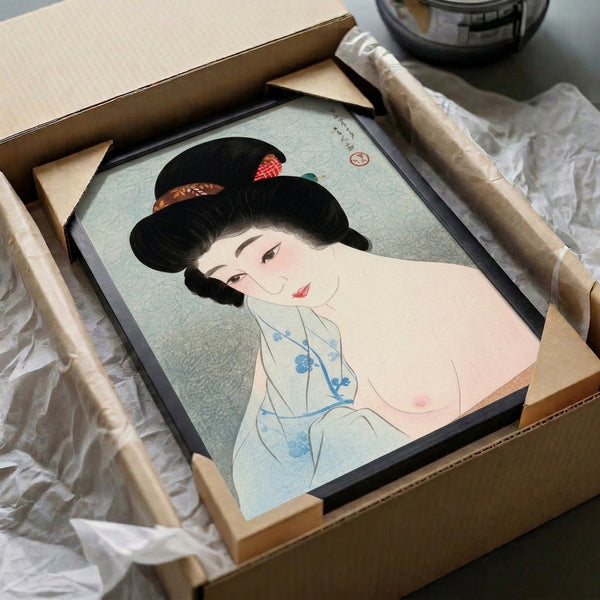Serene geisha portrait in Japanese woodblock aesthetic, showcasing traditional kimono art with delicate pale blue and cream coloring complemented by coral red and gold accents framed for display.