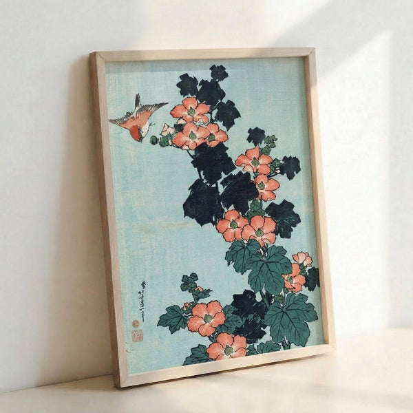 Framed poster of a peaceful bird composition with crimson hibiscus blossoms and foliage in soft greens and creams, showcasing the refined aesthetic of classical Japanese woodblock printmaking.