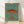 Framed Japanese woodblock print featuring delicate line art of a jellyfish and mushroom in sage green and rust red on cream background, naturalistic botanical artwork.
