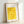 Contemplative woodblock-inspired poster displaying ornamental vines climbing a geometric trellis pattern in muted yellows and creams, with serene botanical character.