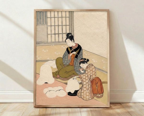 Framed Japanese woodblock print depicting a tender moment between a mother in an elegant kimono and her child in a warm domestic interior, rendered in cream, ochre, and terracotta tones.