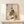 Framed wall art capturing a gentle moment between woman and child in period kimono within a tranquil interior space, executed in muted terracotta and olive hues.
