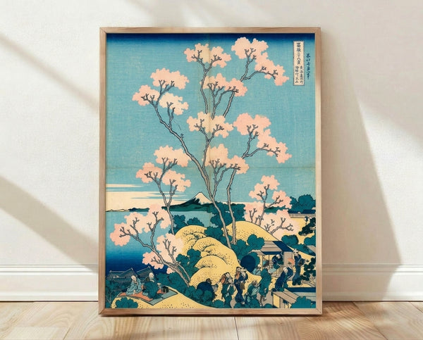 Serene Japanese woodblock landscape poster featuring Mount Fuji framed by cherry blossoms in soft cream and pale yellow, with prussian blue water and teal accents.