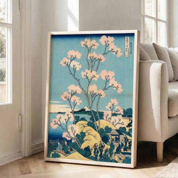 Japanese landscape wall art print showing a serene composition of Fuji mountain, flowering cherry trees, water, and buildings in soft teal, cream, and blue hues.