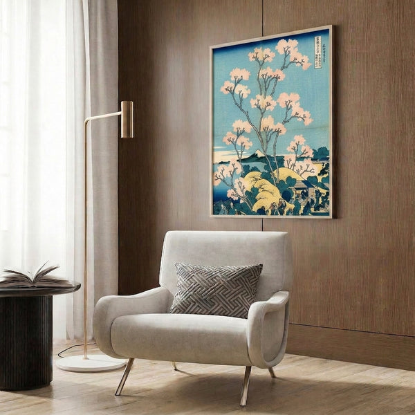 Contemplative Japanese art print with Mount Fuji, cherry blossoms, and architectural elements framed on wall, executed in harmonious cream, teal, and deep blue tones.