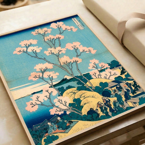 Serene framed woodblock-style poster depicting a peaceful Fuji landscape with blooming cherry trees, figures, and water in soft cream, prussian blue, and pale yellow.