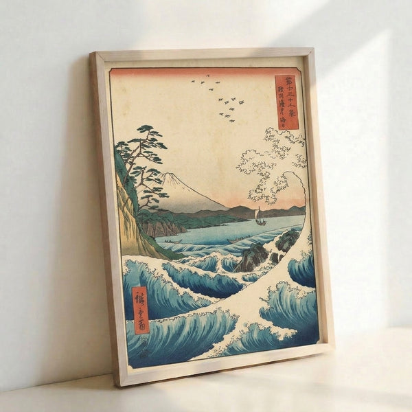 Contemplative Japanese woodblock print showing sacred Mount Fuji landscape with crashing seascape, pine grove, and distant boat rendered in cool indigo and teal palette.