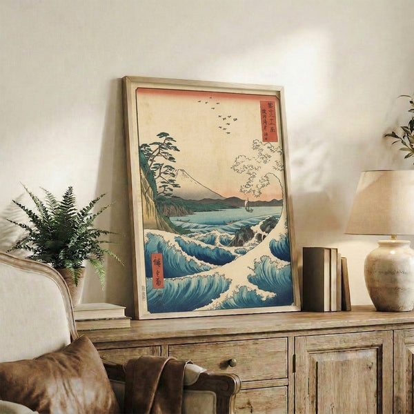 Ukiyo-e inspired woodblock print of Mount Fuji seascape mounted on wall, depicting majestic peak above turbulent waves with teal and dark green natural elements.