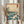 Japandi wall art print featuring Mount Fuji sacred mountain above dramatic seascape with birds and vegetation in serene blue and burnt orange tones.