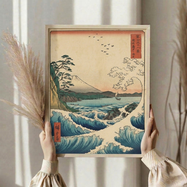 Japandi wall art print featuring Mount Fuji sacred mountain above dramatic seascape with birds and vegetation in serene blue and burnt orange tones.