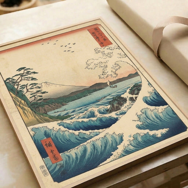Traditional Japanese woodblock composition with Mount Fuji rising above churning seascape in deep blue tones, accompanied by pine tree, boat, and flying birds.