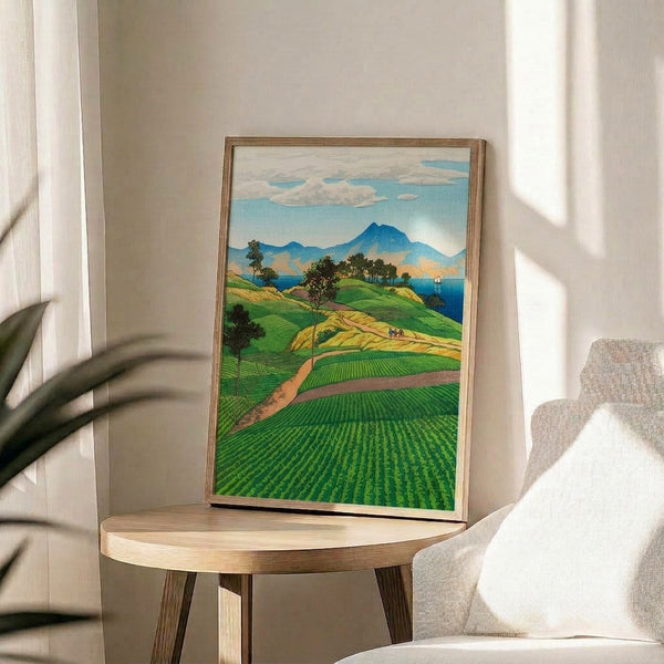 Nostalgic Japanese woodblock scene of peaceful tea fields and mountains in ochre, emerald, and deep blue, with a lone sailboat on the water beneath a cream-colored sky.