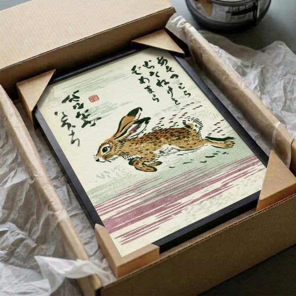 Traditional Japanese-inspired poster art displaying a graceful hare in ochre and tan tones with contemplative calligraphy, hung as a framed wall print.