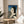 Framed ink wash painting of a woman in traditional dress engaged in intimate grooming moment, Japanese artistic style with serene elegance and sophisticated color harmony.