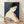 Framed vintage Japanese woodblock print depicting a serene woman in an ornate kimono with deep teal and red-coral tones, her face obscured in contemplative elegance.