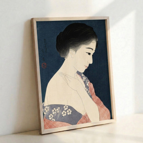 Vintage Japanese wall art showing an elegantly composed woman in traditional kimono with intricate textile patterns rendered in deep teal, coral, and cream on a framed poster.