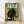 Art Deco style jazz poster featuring a musician in profile playing double bass against a stylized cityscape in forest green, golden yellow, and cream, evoking vintage nightclub glamour.
