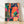 Retro jazz trio screen print featuring musicians with trumpet and piano, surrounded by lanterns and foliage in deep teal, coral orange, and magenta pink tones, framed as wall art with art deco and Y2K styling.
