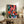 Modern pop art print on wall showing a dynamic musician playing trumpet amid celebratory geometric forms in bright jewel tones and warm orange hues.