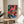 Framed abstract jazz artwork with an expressive trumpeter rendered in bold magenta, teal-green, and navy blue colors against energetic compositional elements.