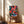 Colorful pop art wall poster depicting a vibrant trumpet player surrounded by musical instruments in striking red-orange, pale pink, and teal geometric designs.