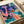 Contemporary abstract poster showcasing tropical jazz celebration with silhouetted trumpeter and band surrounded by palm leaves in purple, coral, turquoise, and golden yellow.