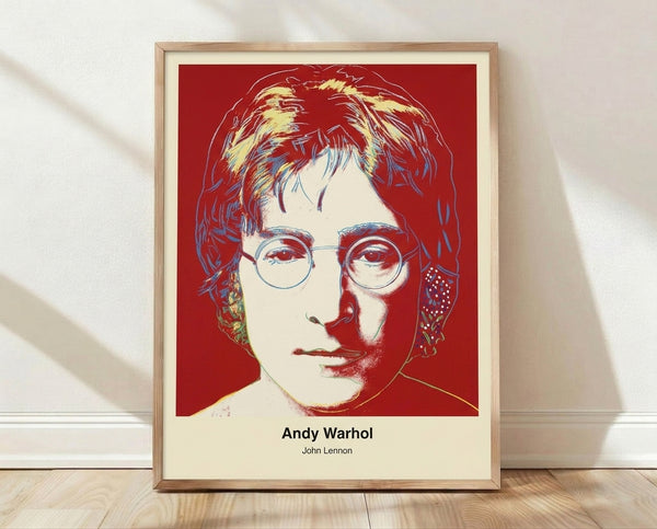 Bold pop art portrait of John Lennon in vibrant primary colors and black, iconic musician tribute in Warhol style framed on wall.
