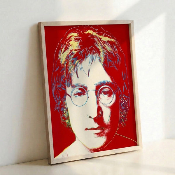 Warhol-inspired portrait of John Lennon with vivid color blocking and high-contrast graphic elements, displayed as a framed wall art print.