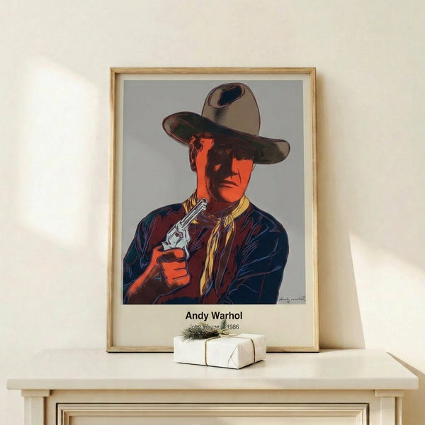 Framed pop art poster of a cowboy icon rendered in bold yellow, orange, green, and black with Warhol's characteristic bold outlines and ironic commentary.