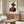 Pop art cowboy portrait in contrasting orange, white, and green with black graphic elements; a bold contemporary take on western imagery.