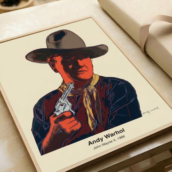 John Wayne pop art wall print featuring Warhol's iconic style with dramatic yellow, orange, and green color fields and thick black outlines.