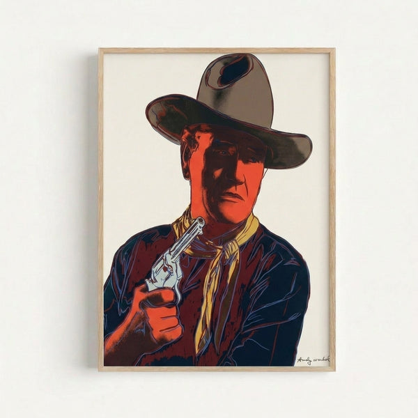 Framed print featuring John Wayne's face rendered in bright contrasting hues and high-contrast silkscreen technique, pop art aesthetic.