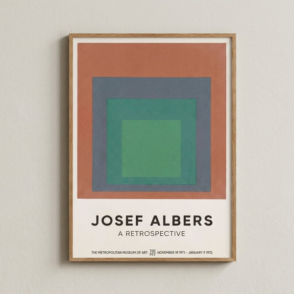 Framed abstract art print with concentric color fields in warm and cool tones—terracotta, sage, and blue—evoking calm geometric harmony.