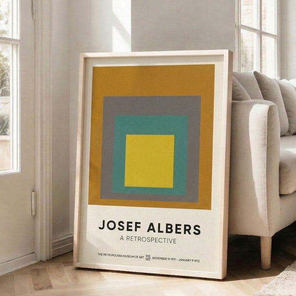 Minimalist geometric wall art of layered squares in gold, gray, and teal tones evoking a serene, meditative mood.