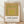Framed Bauhaus art print featuring nested squares in gold, olive green, peach, and chartreuse yellow on a gallery wall.