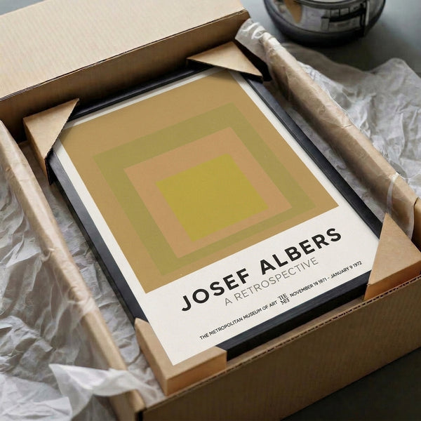 Museum-quality print of nested colored squares in olive, chartreuse, and warm peachy-gold, mounted as framed modern wall art.