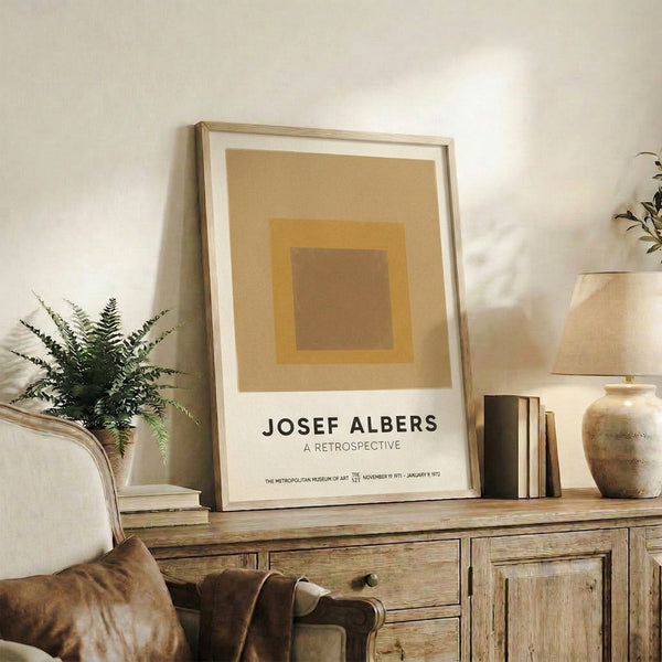 Color field artwork showing nested geometric squares in warm earth tones, representing the harmonious principles of mid-century minimalist design.